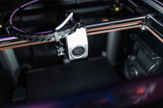 Close-up of a 3D printer's toolhead with AI LiDAR sensor in operation